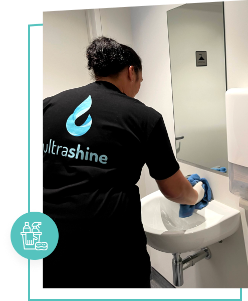 UltraShine employee cleaning shared commercial bathrooms